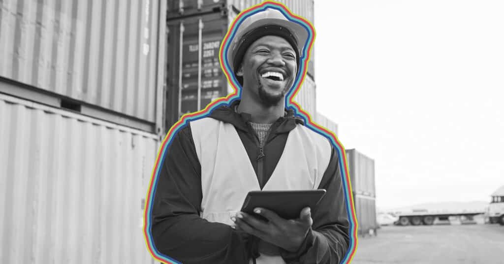 Dock worker smiling as a result of a successful customer marketing strategy.