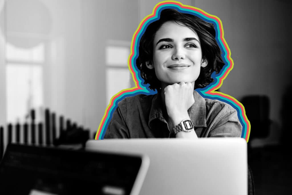 A smiling woman in a black and white photo is outlined with colorful rainbow bands of color.