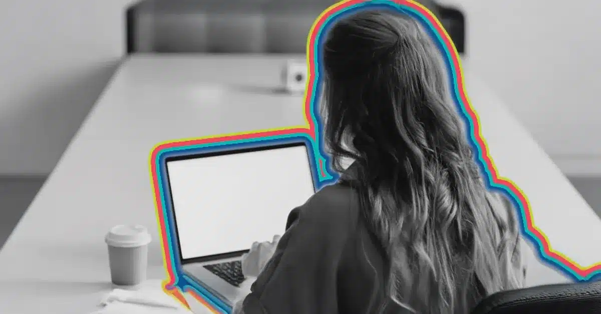 Automated customer segmentation illustrated by an image of a woman looking at a laptop.