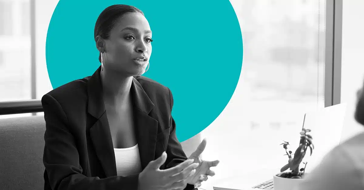 Female bank marketer converses with an off camera client.