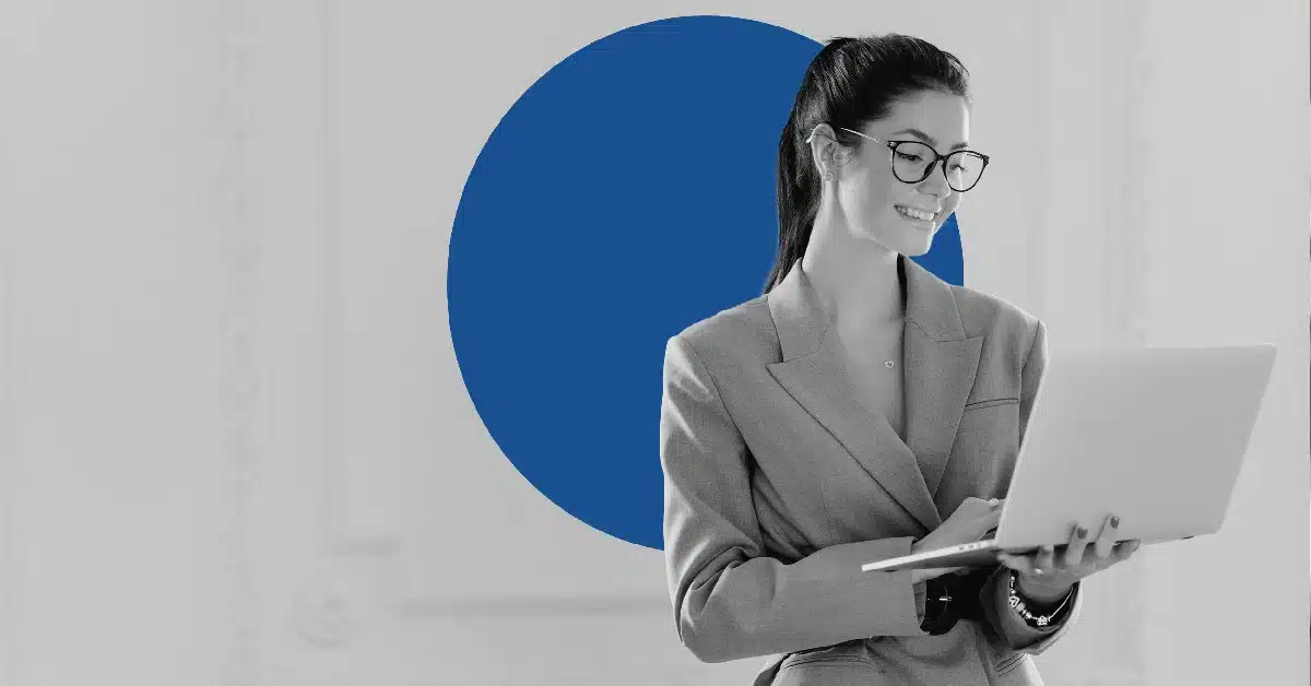 Woman checking email marketing metrics on a laptop.