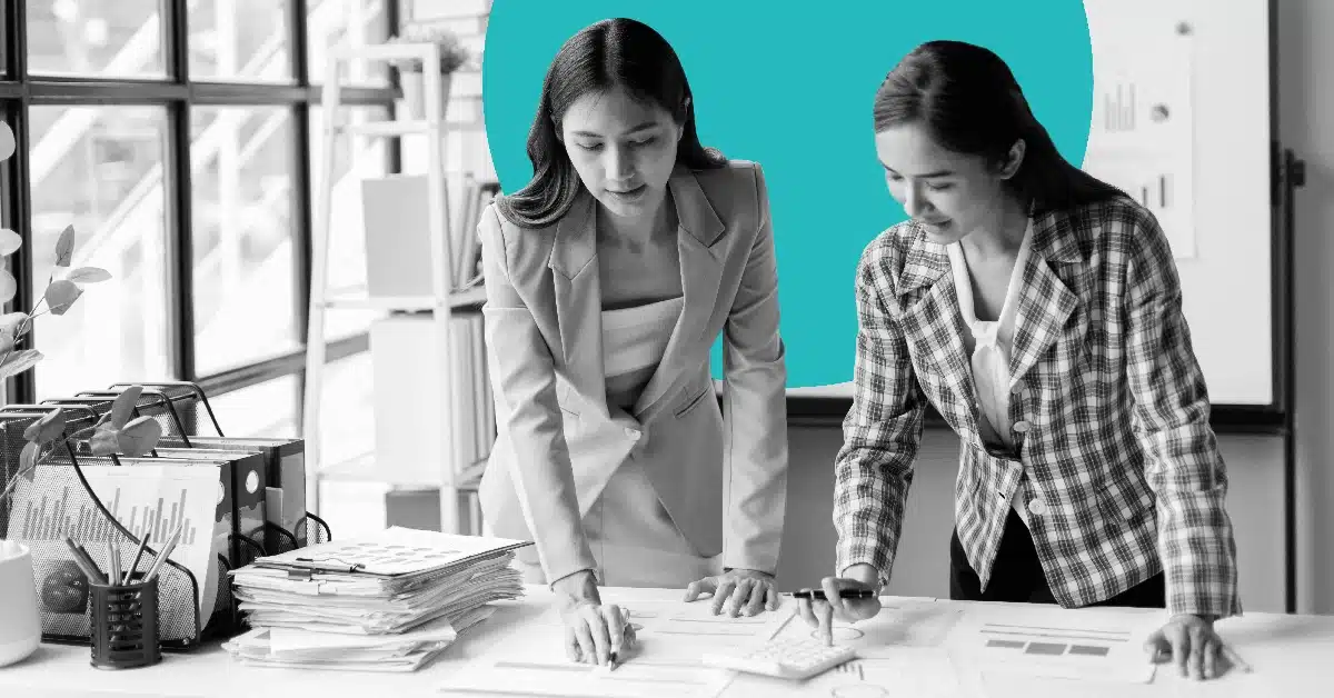 Two professionals calculating email subscriber value.