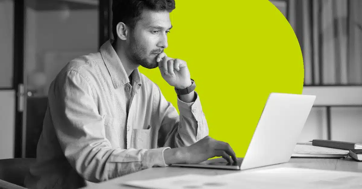 Man reading an email on his laptop.