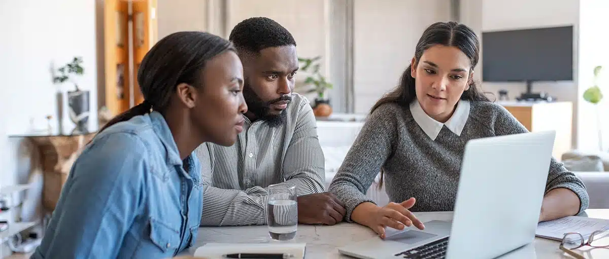 Couple of potential investors enticed by a financial advisor marketing strategy.