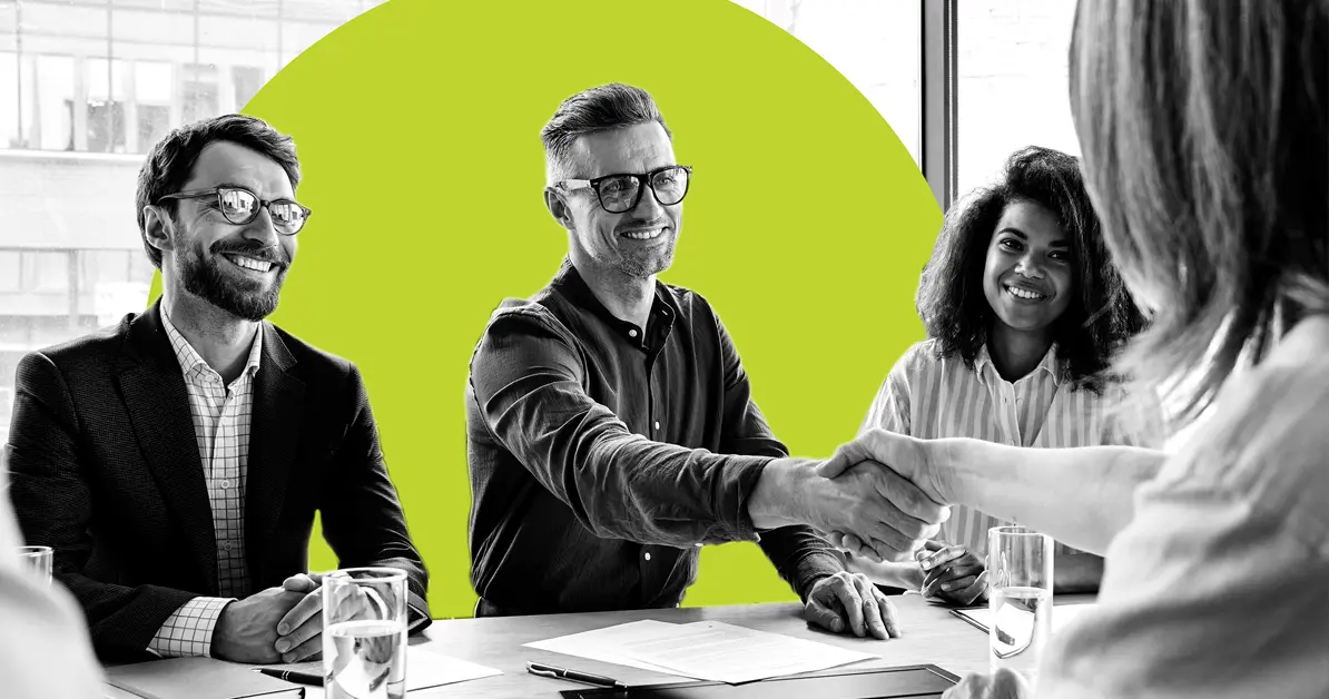 Act-On team shaking hands with a client.