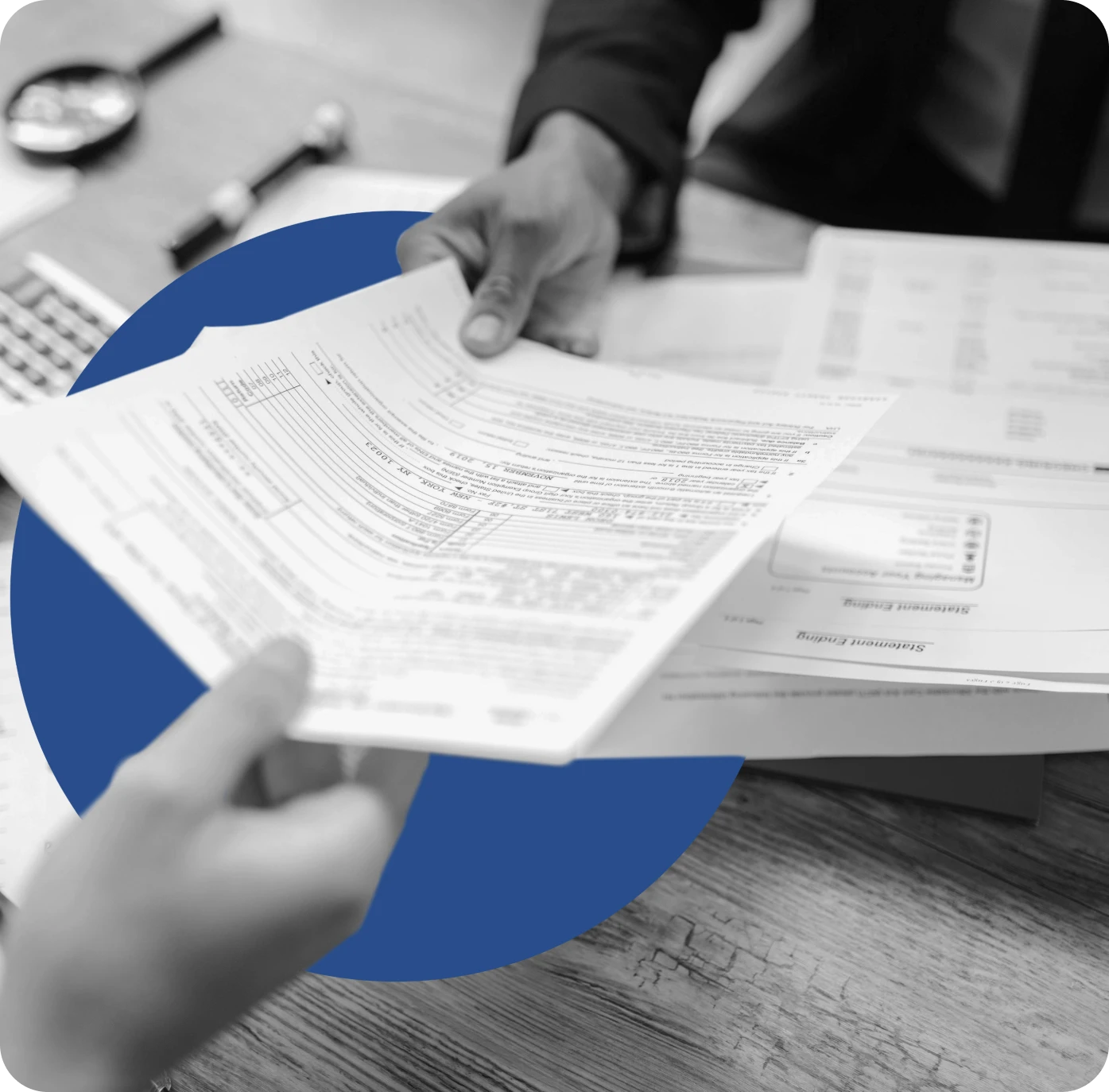 Man handing a piece of paper to another person illustrating the benefits of marketing automation for insurance agencies.