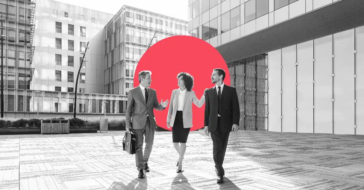 Colleagues discussing their marketing automation team structure.