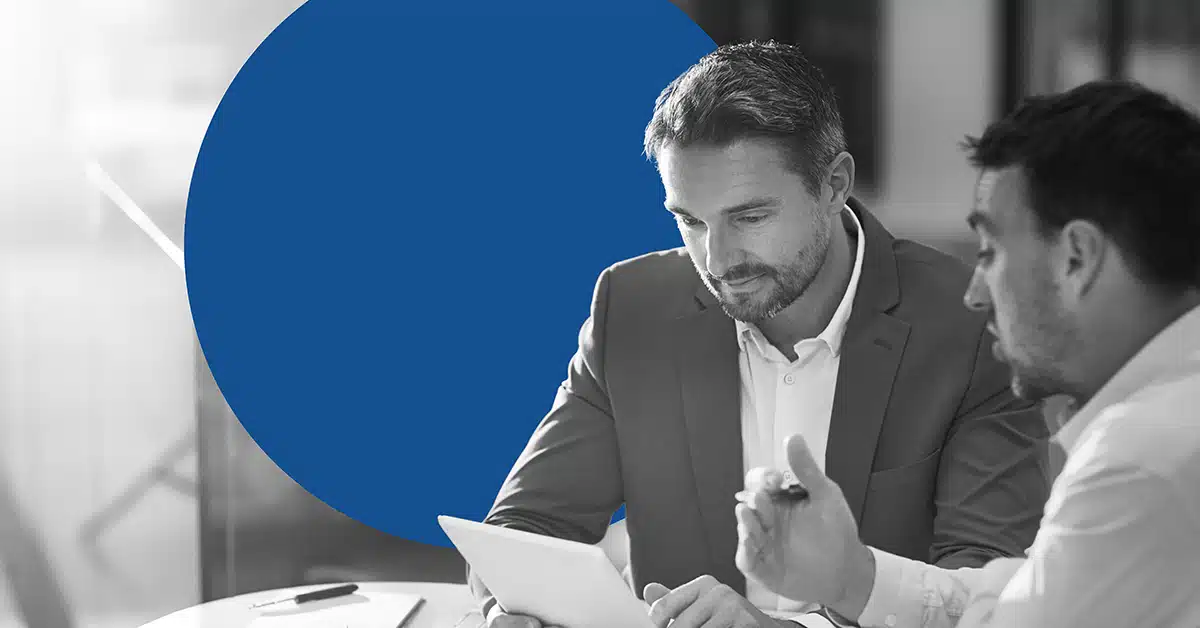 two professionals evaluating Marketo vs Eloqua.