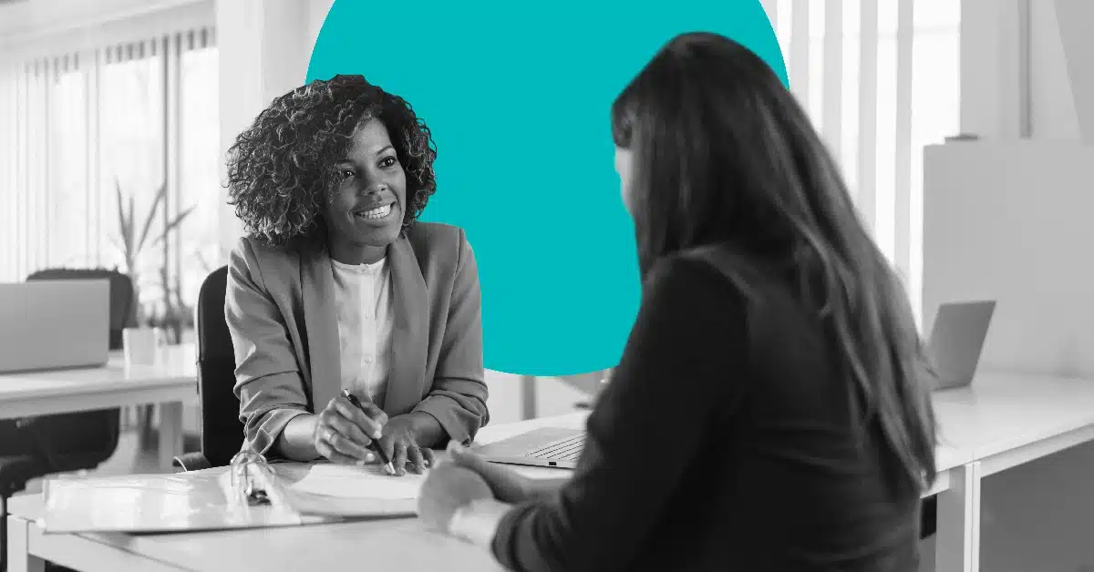 Woman asking a client questions to illustrate the idea of progressive profiling.