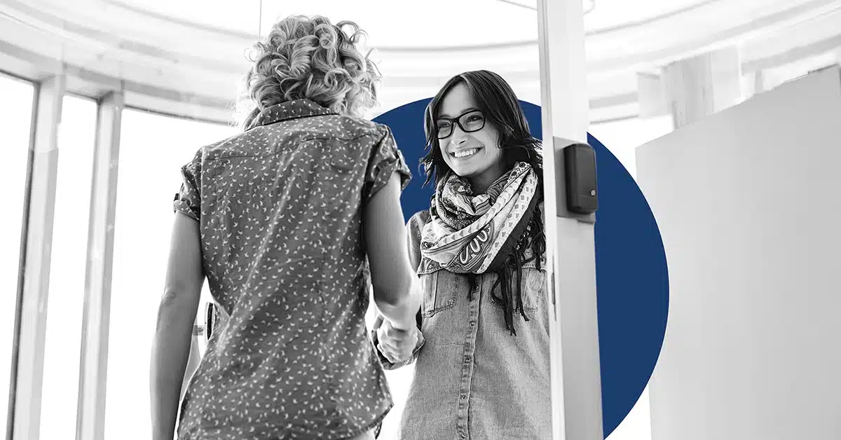 Two women working on retention marketing.