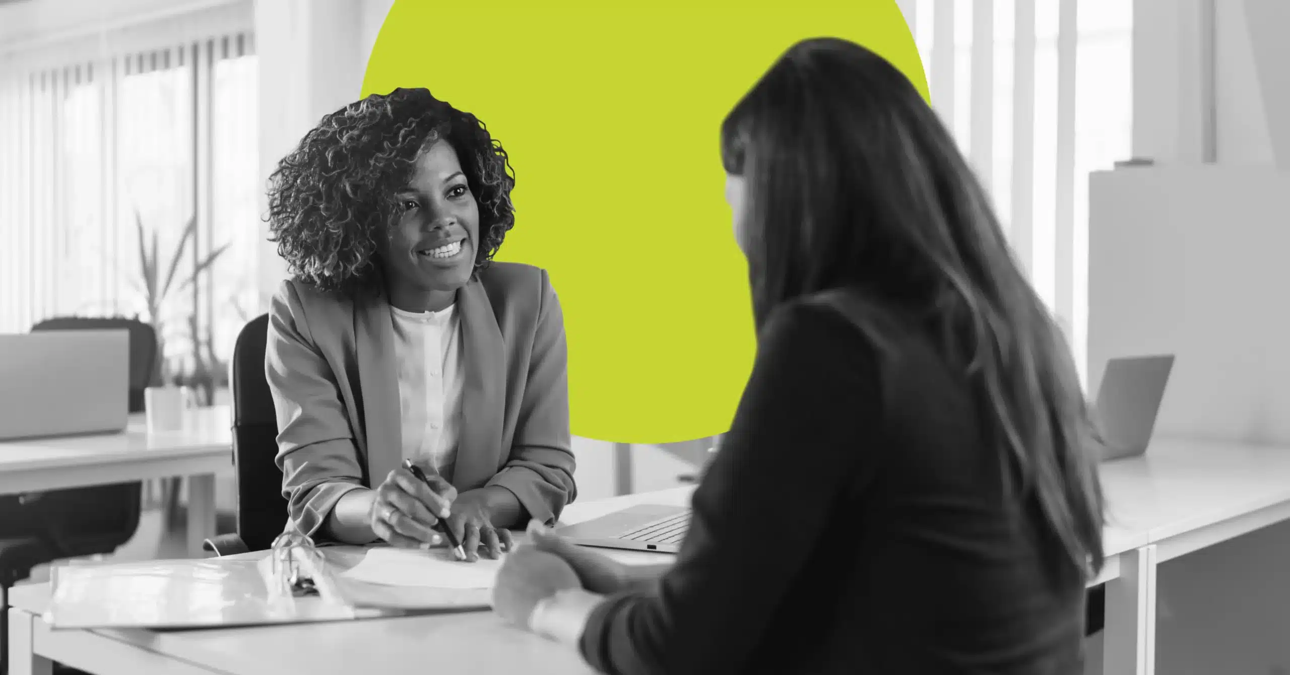 Woman guiding a marketing client through support options.